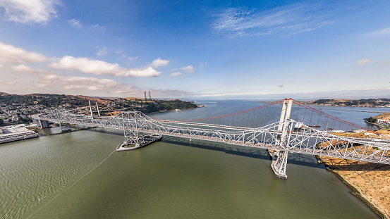 Aerial stock photos of the Carquinez bridges spanning the Carquinez Strait at the northeastern end of San Francisco Bay. The bridges, part of Highway 80 connect the cities of Crockett and Vallejo.