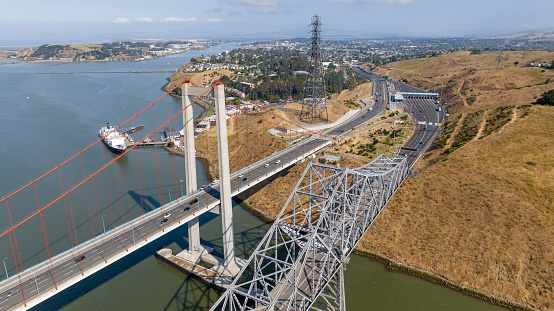 Aerial stock photos of the Carquinez bridges spanning the Carquinez Strait at the northeastern end of San Francisco Bay. The bridges, part of Highway 80 connect the cities of Crockett and Vallejo.
