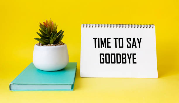 istock Time to say goodbye. Message on notepad and yellow background. Conceptual image. 1634178018