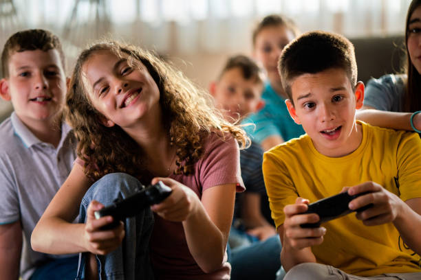 istock Children playing video games at home 1634184423