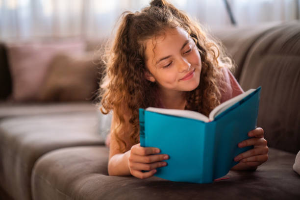Teenage girl reading a book