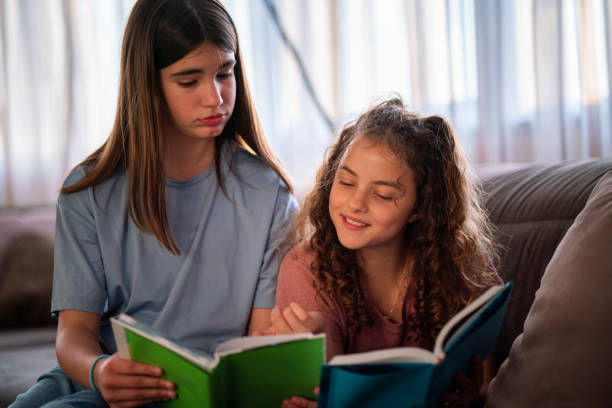 istock Two girls studying at home 1634189245