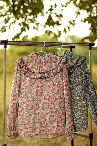 istock Bright nightgowns on hangers outdoors. 1634200381