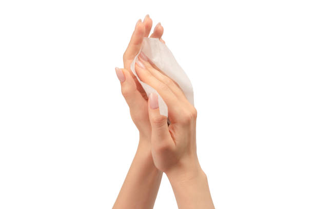 istock Wet wipe in a woman hand isolated on a white background. 1634219997