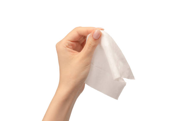 istock Wet wipe in a woman hand isolated on a white background. 1634220231