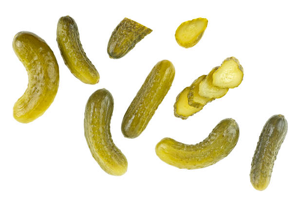 istock Marinated pickled cucumbers isolated on a white background, top view. Flat lay. 1634261203