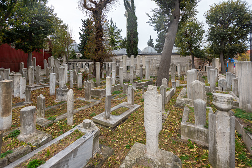 Johannishus, Sweden - February 14, 2015: Small white building on semetary. Grave stones in foreground.