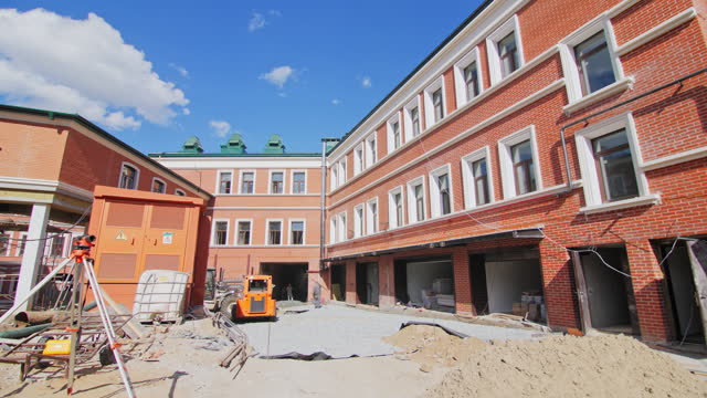 Building team mechanically renovates courtyard of building