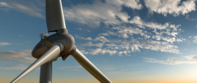 Wind turbine rotor blades against sun set sky - panorama