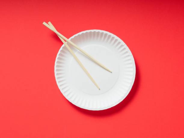 Holding the red pork with chopsticks isolated on white background