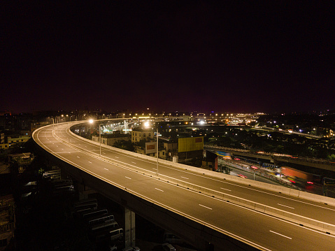 Drone View of Dhaka Elevated Expressway. Mega project of Bangladesh. Aerial View of Dhaka City Nightscape.