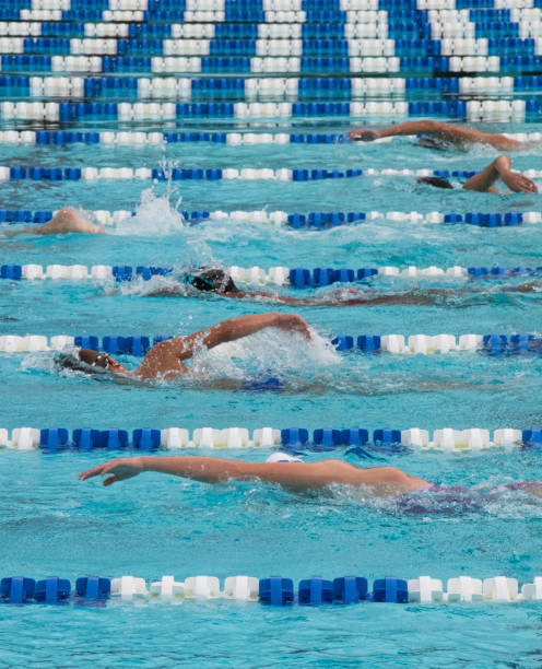 istock Athletes competing in swimming pool 1634353446