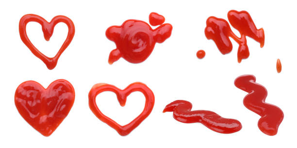 istock Set of different ketchup smears on white background 1634363136