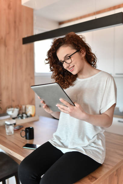 istock Smiling Female Beauty Having Digital Tablet Video Call 1634380428