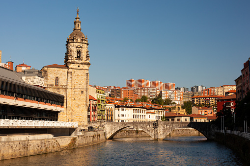 View of the historic La Ribera Market and the San Anton church in the Nervion river