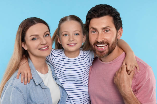 istock Happy family together on light blue background 1634426722