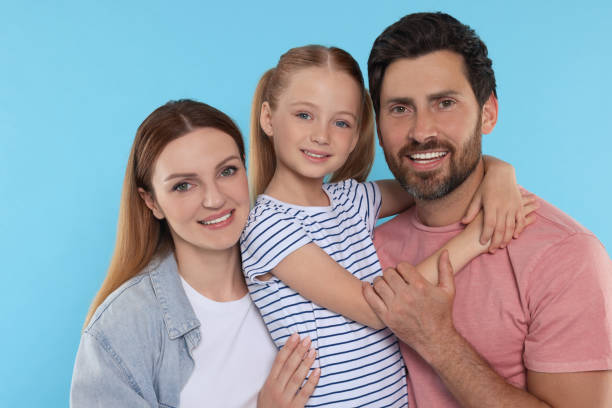 istock Happy family together on light blue background 1634428633