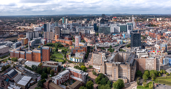 Birmingham, UK - August 21, 2023.  An aerial panoramic view of a Birmingham cityscape skyline with old and modern buildings and skyscrapers
