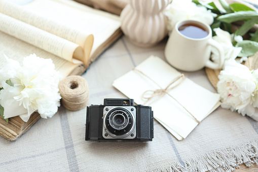 retro photo camera with book and vintage letters.