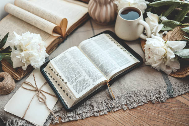 istock Open bible in home morning interior 1634437755
