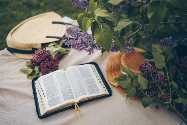 istock Open bible in the garden, christian concept 1634445751