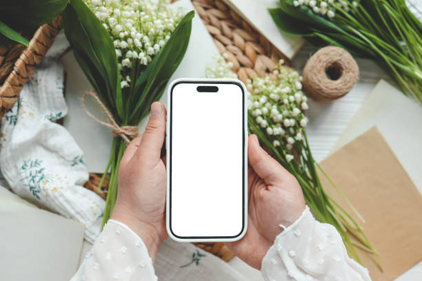 istock Phone with isolated screen, place for your congratulations, spring decor 1634450015