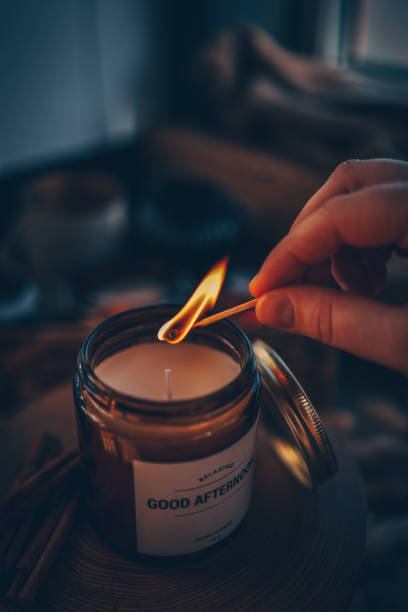 istock Match in hand lighting candles, aesthetics 1634462804