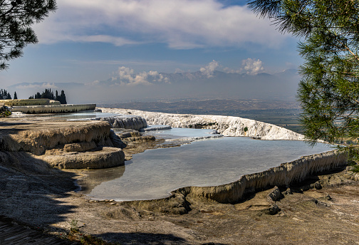 Travertine terraces made from the hot springs at Pamukkale National Park, leaving deposits of calcium. Pamukkale means cotton castle in Turkish and is in the province of Denizli in southwestern Turkey.