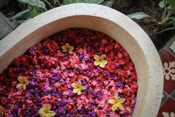 istock Bath tub with flower petals 1634534284