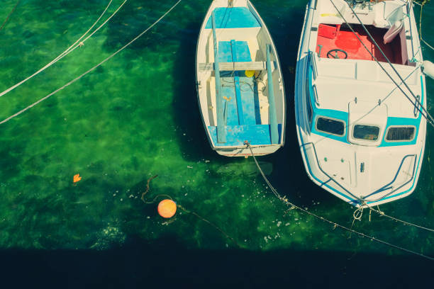 Moored Boats with Sparce Ocean Harbour View and a Buoy Marina