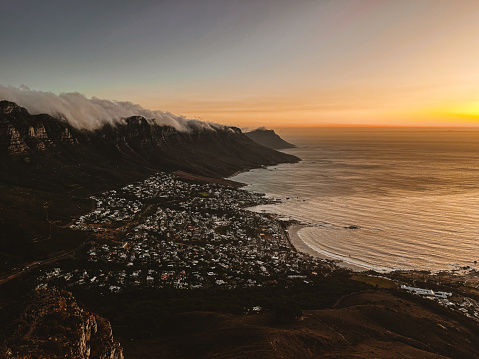 Looking at Camps Bay from Lion's Head during Sunset, tablecloth over the Twelve Apostles