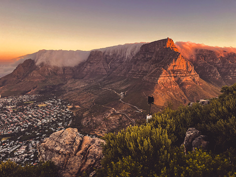 Beautiful Table Mountain during golden hour with Tablecloth, Cape Town. Viewed from Lion's Head, looking at Gardens.