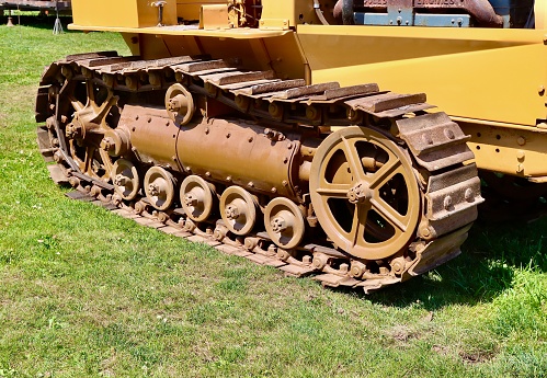 Close-up of tractor tracks on old equipment
