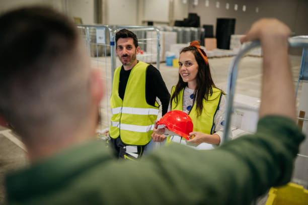 istock Manager and employees in warehouse 1634582735