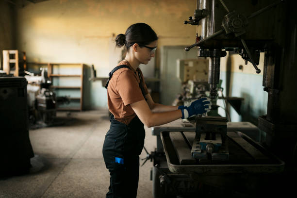 istock Woman worker working with a drilling machine in her metal workshop 1634602310