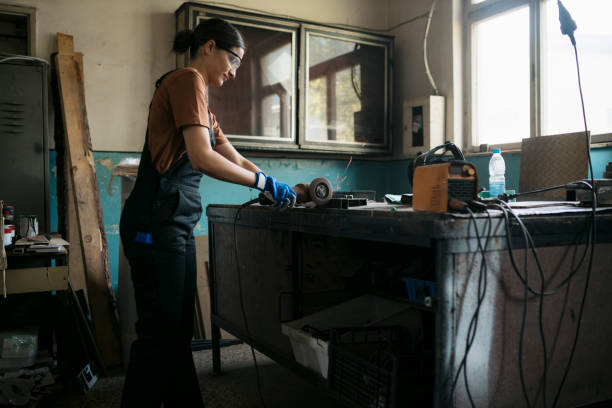 istock Young woman working in the workshop with a grinder 1634605422