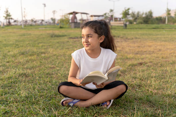 istock Girl reading a book. 1634630234