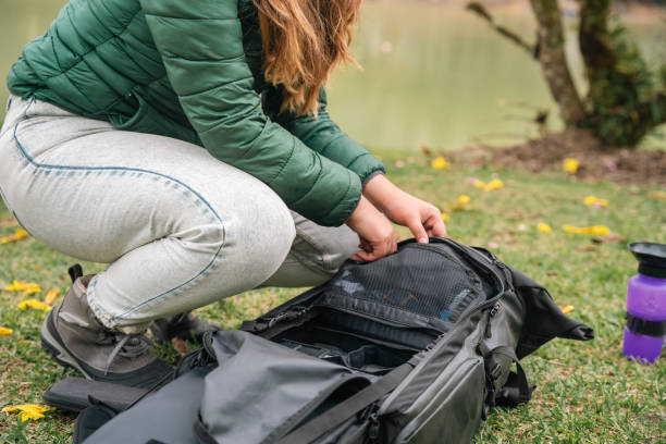 istock A young woman unpacking next to her tent 1634650446