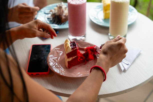 istock Multi-generation family talking and having fun in a cafe while eating a slice of cake 1634650957