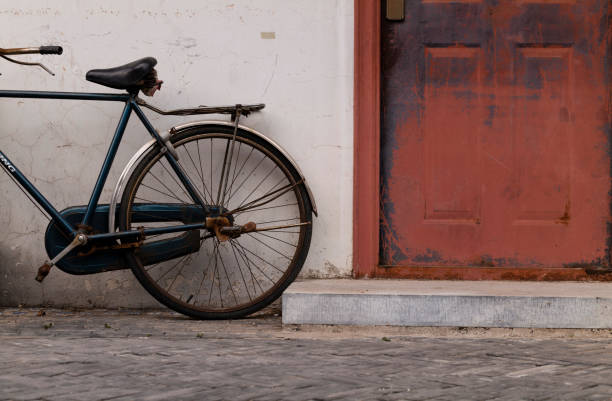 istock Bicycle against wall on street. Beijing, China 1634733115