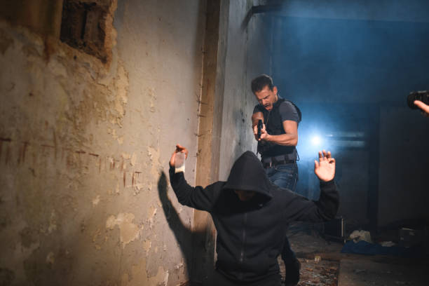 istock Handsome Detective Pointing At A Criminal With A Fire Gun 1634771419