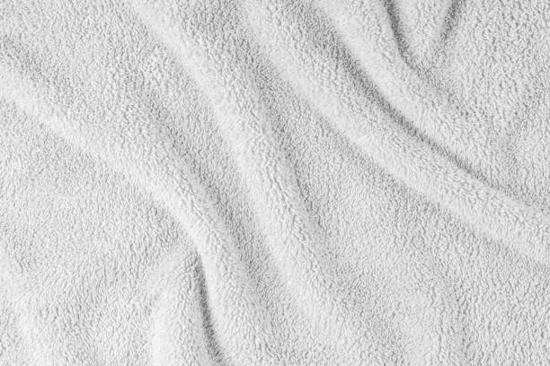 istock Terry cloth, white towel texture background. Soft fluffy textile bath or beach towel material 1634871163