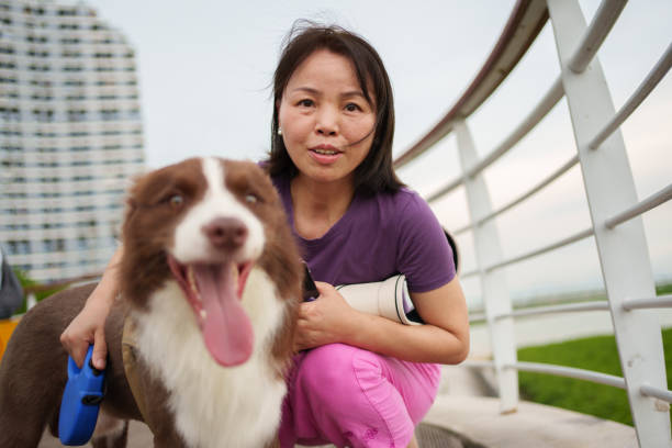 istock woman and her collie 1634883368