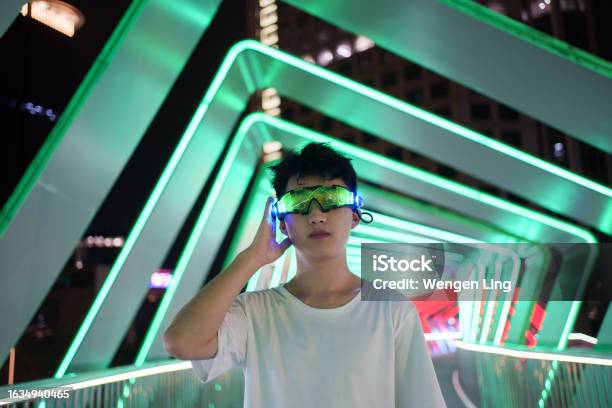 Man Using Vr Smart Glasses Stock Photo - Download Image Now - 18-19 Years, 5G, Adult