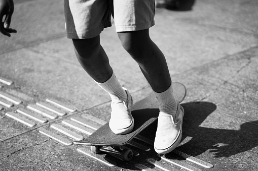 skateboarders or skaters get together and play on the street in freestyle, celebrating world skateboard day.