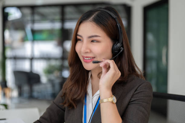 istock A charming Asian female sales agent is working in a customer service call centre. 1634997995