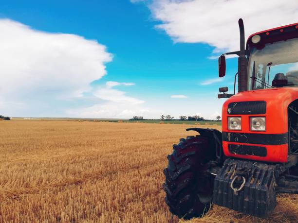 istock Red tractor with the blue sky. 1635049312