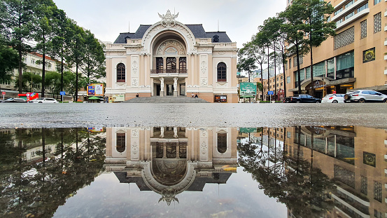 Ho Chi Minh City, Vietnam - ‎‎June 2, 2021 : Saigon Municipal Opera House And Reflection On Water. The Saigon Opera House Was Begun Its Construction In 1898 And Was Completed In 1900.