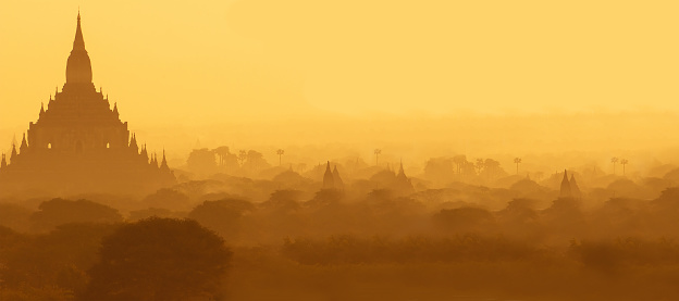 Outlines of the Buddhist temples of Bagan in the pre-dawn fog
