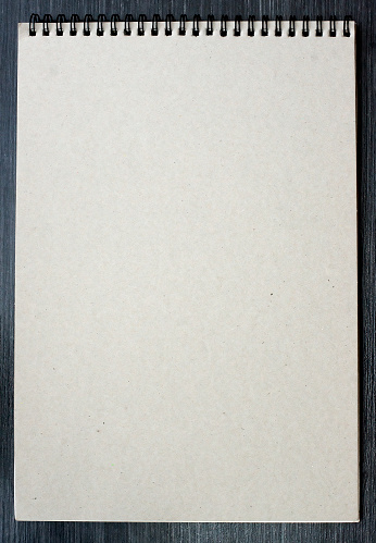 Blank sketchbook on the wooden desk